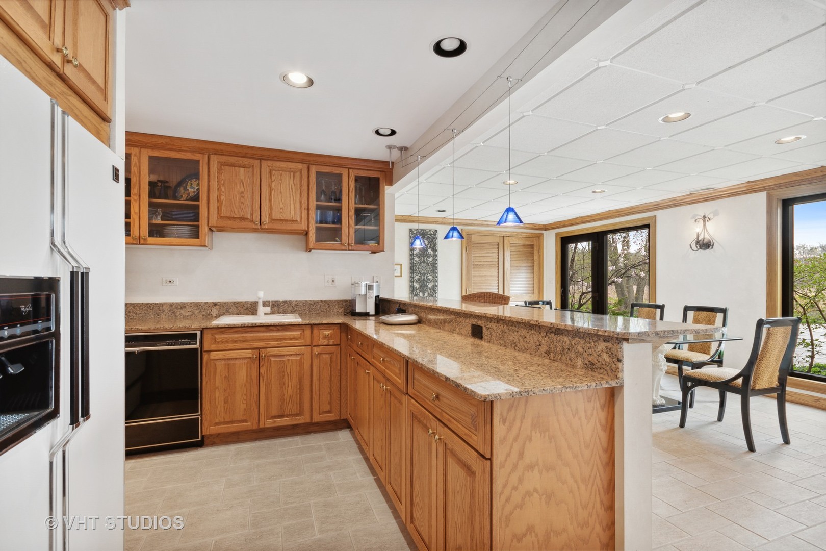 211 Otis Road Barrington Hills, IL 60010 - Photo 41 of 68 a kitchen with stainless steel appliances granite countertop a sink and cabinets