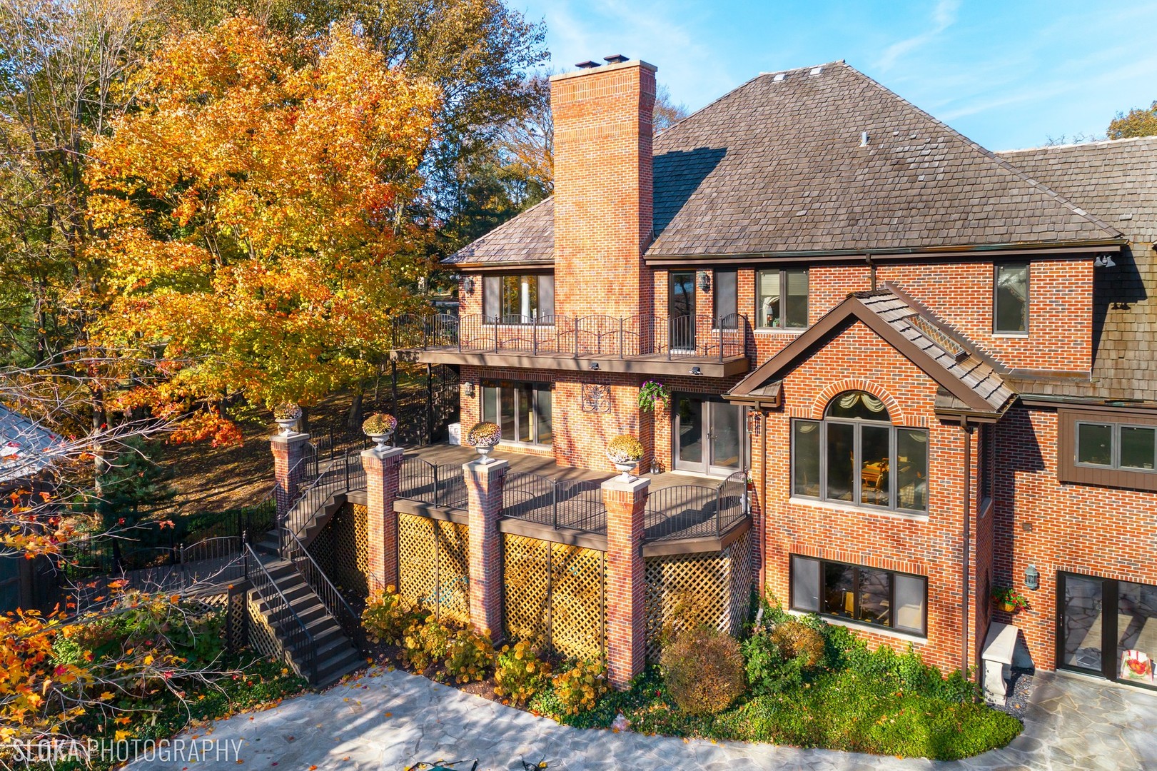 211 Otis Road Barrington Hills, IL 60010 - Photo 50 of 68 a front view of a house with a yard and potted plants