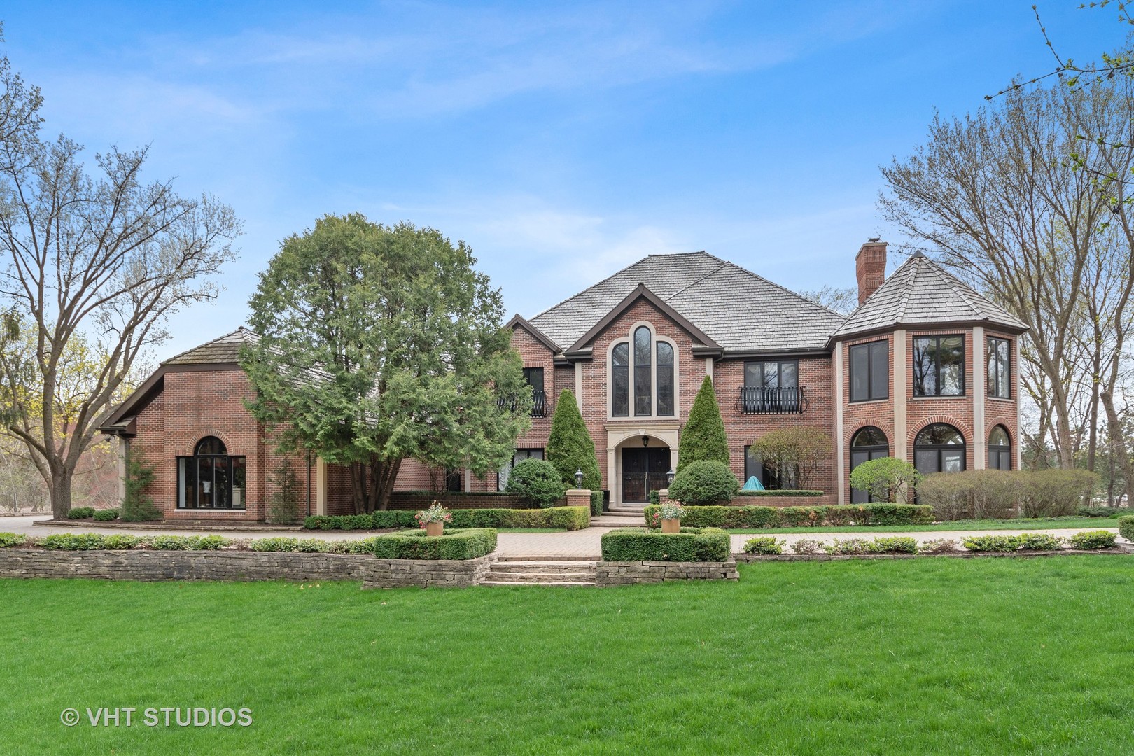 211 Otis Road Barrington Hills, IL 60010 - Photo 5 of 68 a front view of a house with a yard