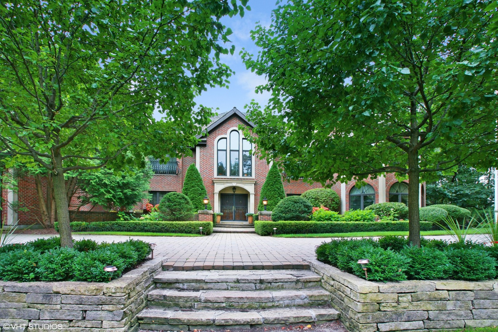 211 Otis Road Barrington Hills, IL 60010 - Photo 6 of 68 a front view of a house with a yard