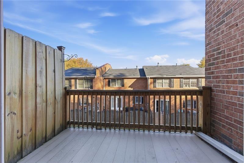 6520 Roswell Road, Unit 79 Atlanta, GA 30328 - Photo 15 of 23 a view of a balcony with wooden floor