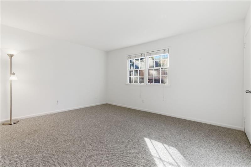 6520 Roswell Road, Unit 79 Atlanta, GA 30328 - Photo 16 of 23 an empty room with windows