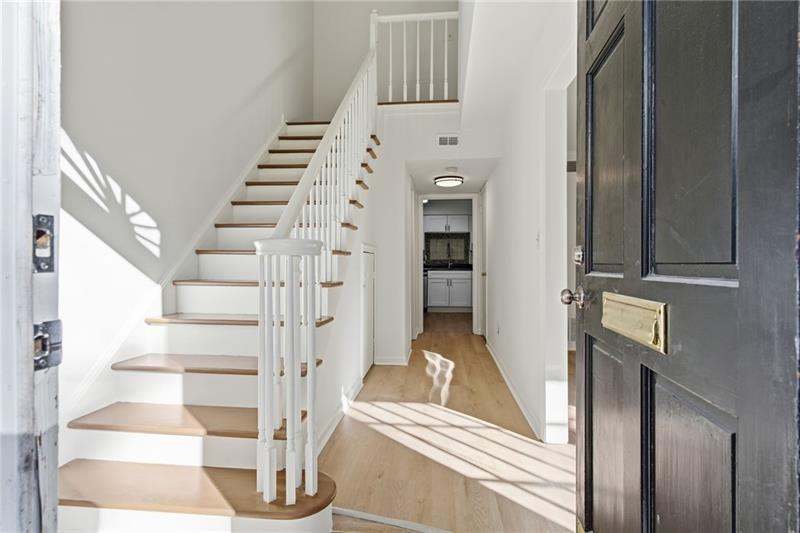 6520 Roswell Road, Unit 79 Atlanta, GA 30328 - Photo 3 of 23 a view of entryway and hall with wooden floor