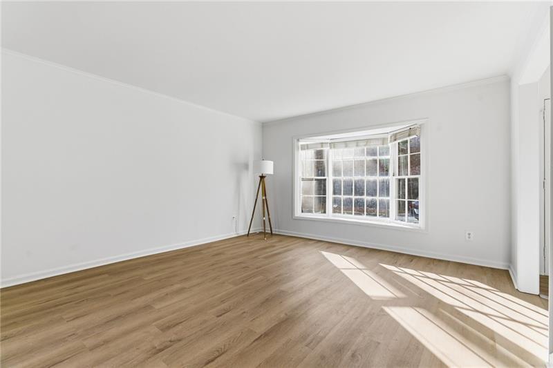 6520 Roswell Road, Unit 79 Atlanta, GA 30328 - Photo 6 of 23 a view of an empty room with a window