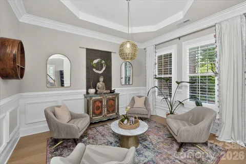 a living room with furniture fireplace and flat screen tv