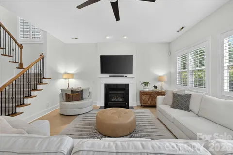 a kitchen with stainless steel appliances granite countertop a refrigerator a stove a sink a microwave and cabinets