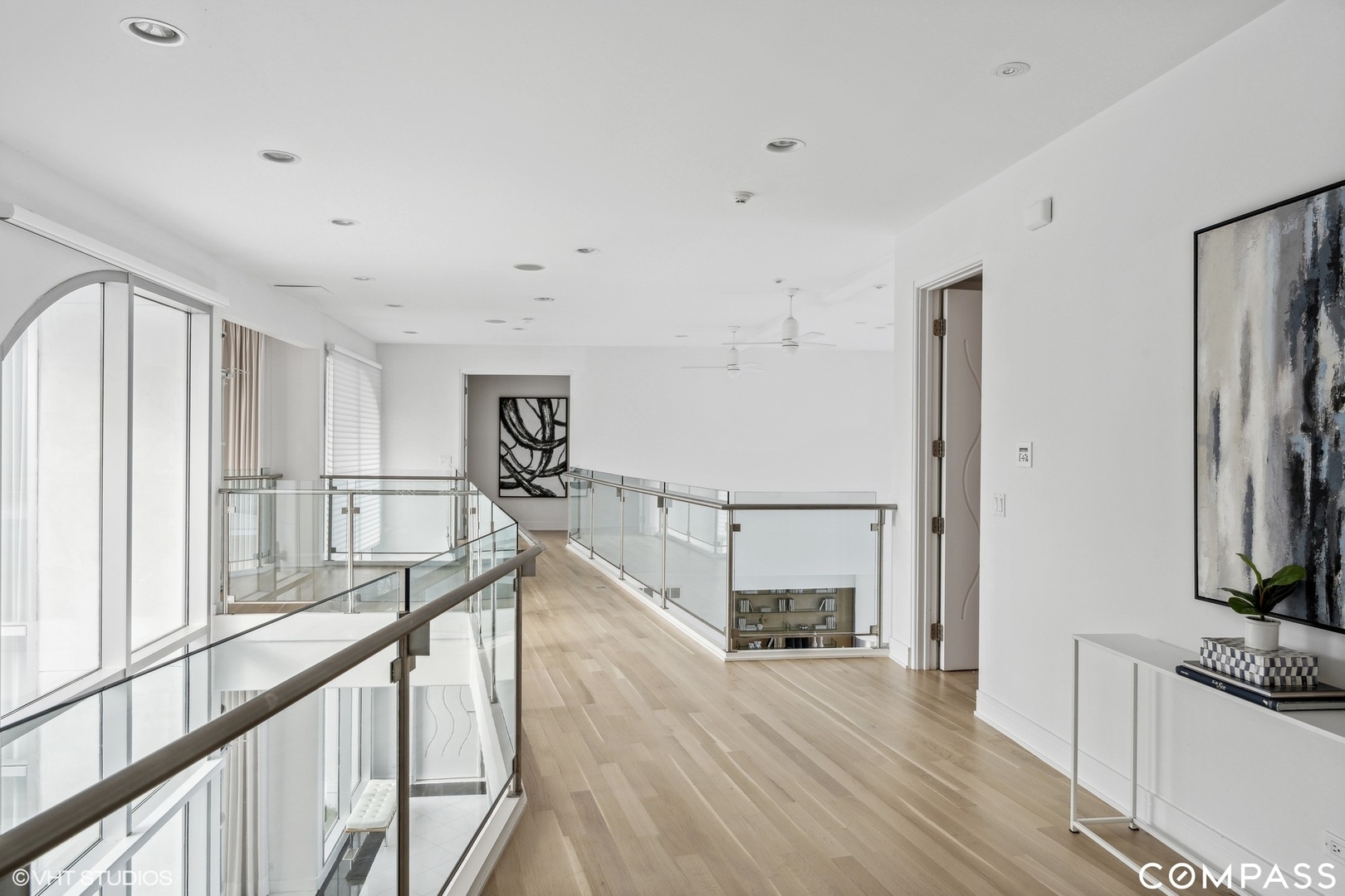 25 Aspen Lane Glencoe, IL 60022 - Photo 22 of 47 a view of a livingroom with wooden floor and stairs