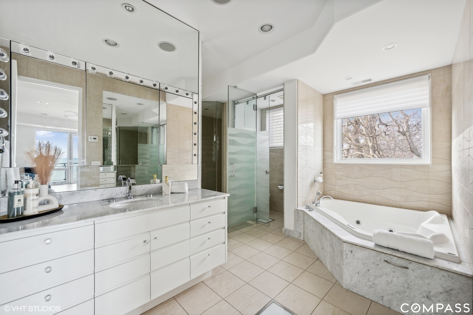 25 Aspen Lane Glencoe, IL 60022 - Photo 26 of 47 a bathroom with a granite countertop tub sink shower and mirror