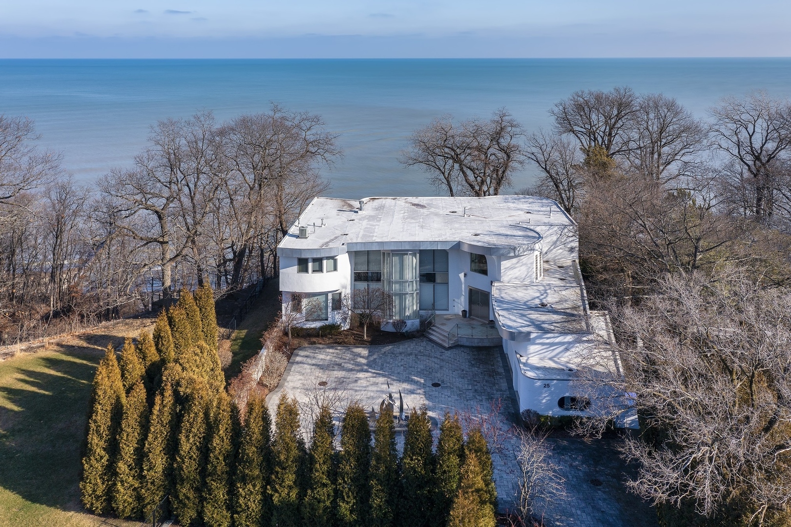 25 Aspen Lane Glencoe, IL 60022 - Photo 43 of 47 a front view of a house with a yard