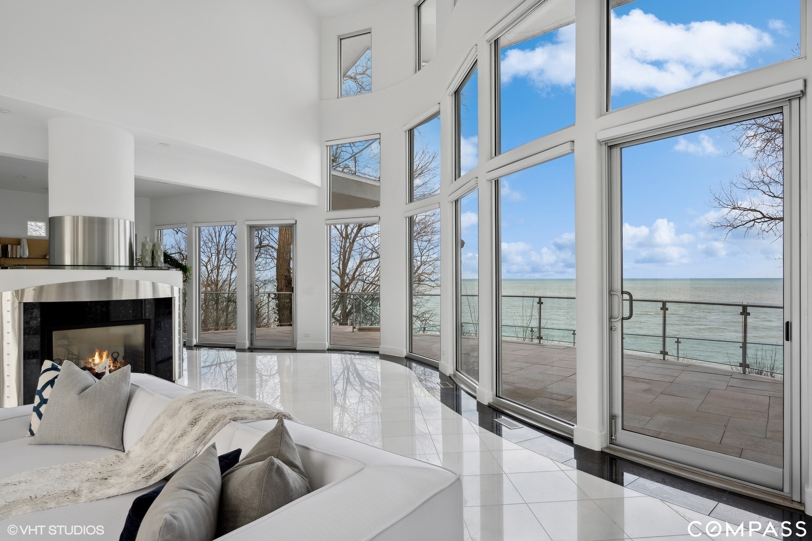25 Aspen Lane Glencoe, IL 60022 - Photo 6 of 47 a living room with fireplace furniture and a floor to ceiling window