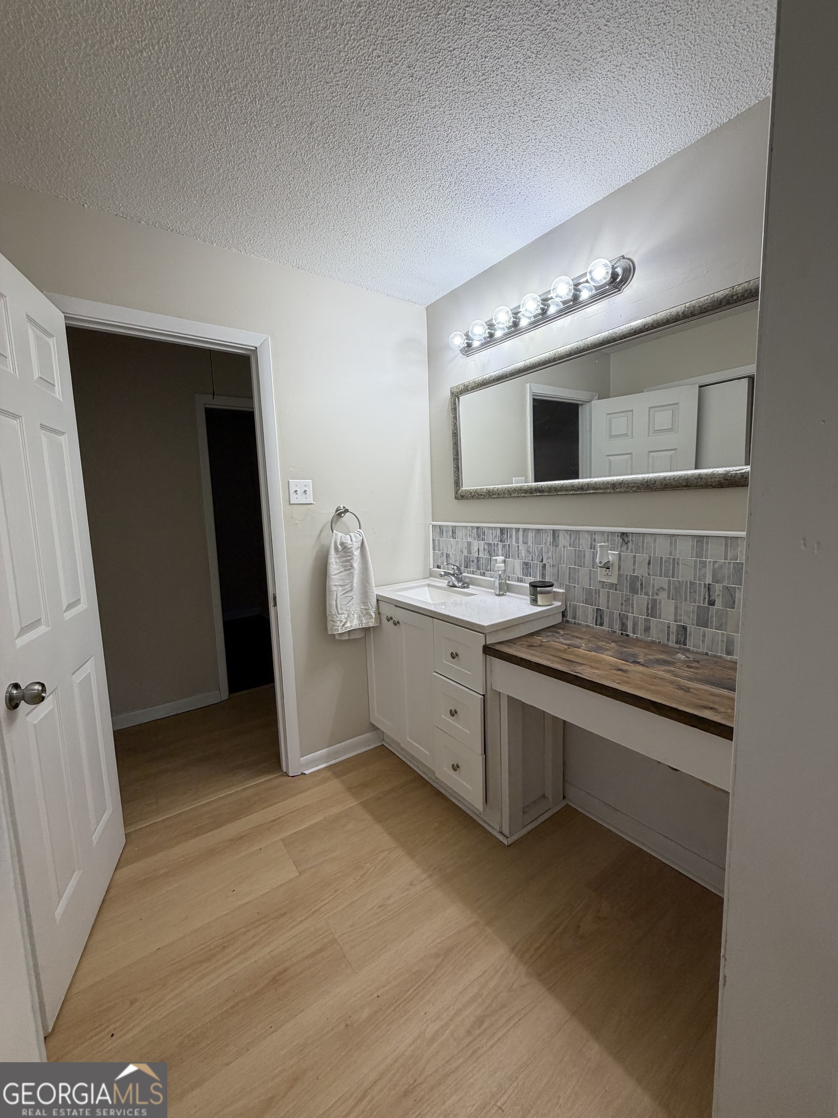 1144 Ridgeway Road LaFayette, GA 30728 - Photo 64 of 66 a bathroom with a double vanity sink and mirror