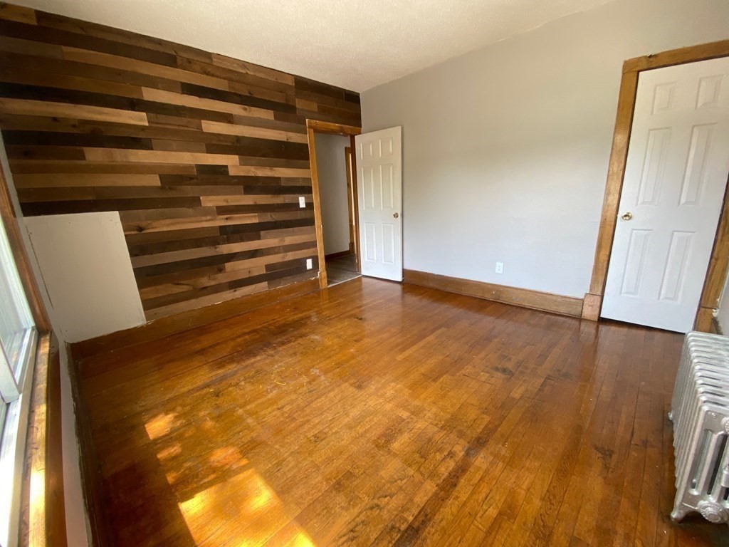 331-335 Allen Street Springfield, MA 01108 - Photo 5 of 8 a view of room and wooden floor