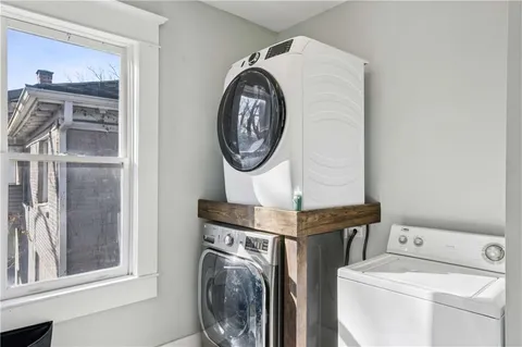 a view of storage and utility room with washer and dryer