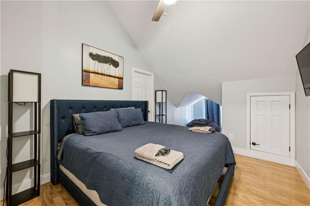 528 Holderness Street Southwest Atlanta, GA 30310 - Photo 17 of 42 a bed room with a bed and a night stand