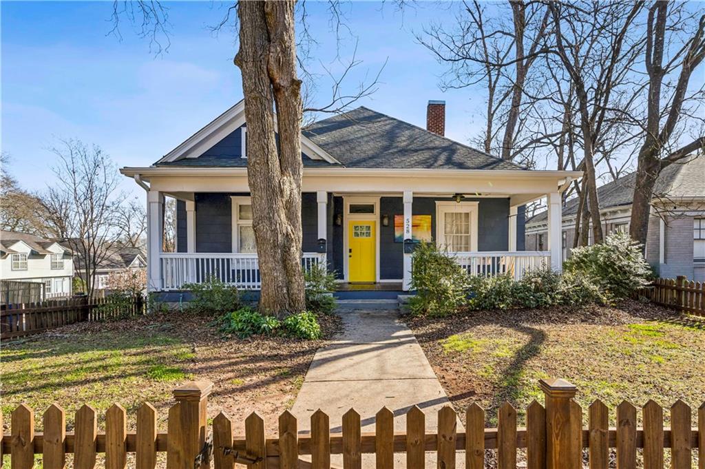 528 Holderness Street Southwest Atlanta, GA 30310 - Photo 2 of 42 a front view of a house with garden