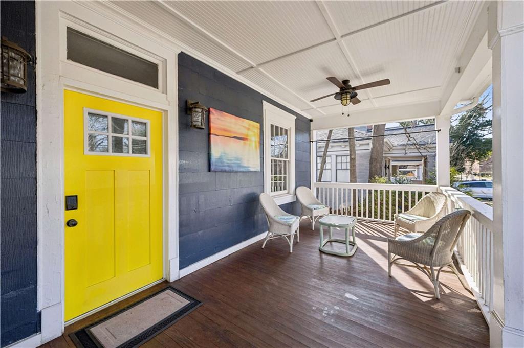 528 Holderness Street Southwest Atlanta, GA 30310 - Photo 24 of 42 a view of a bedroom with wooden floor and a bed