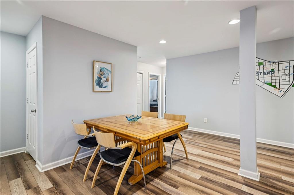 528 Holderness Street Southwest Atlanta, GA 30310 - Photo 27 of 42 a view of a dining room with furniture and wooden floor