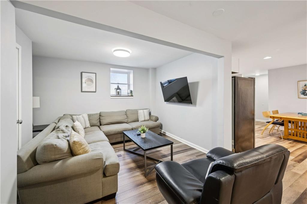 528 Holderness Street Southwest Atlanta, GA 30310 - Photo 30 of 42 a living room with furniture and a flat screen tv