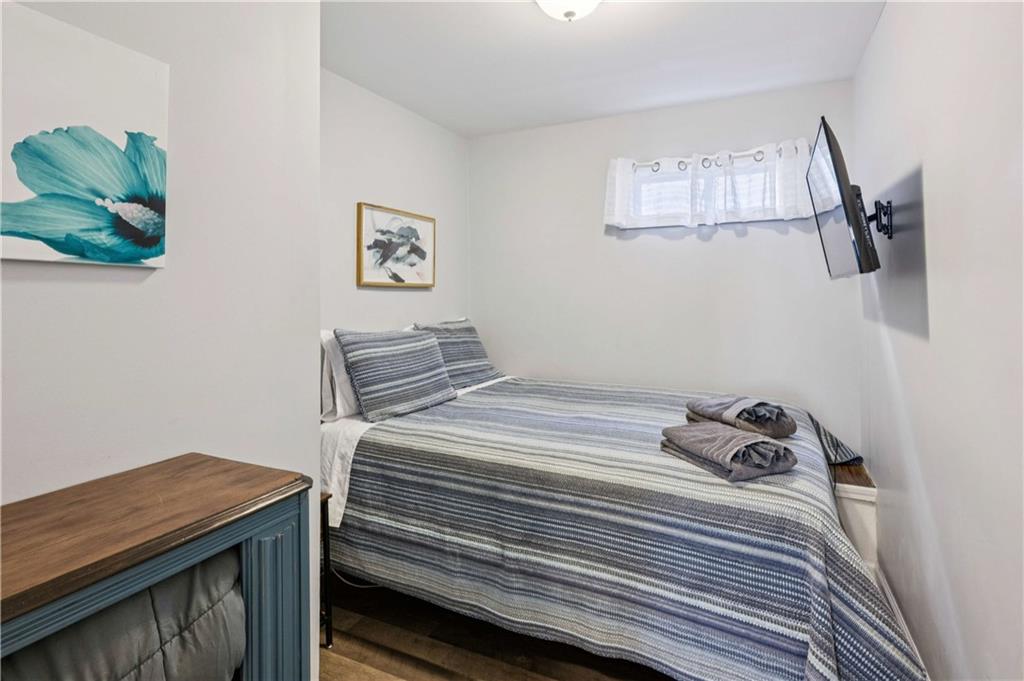 528 Holderness Street Southwest Atlanta, GA 30310 - Photo 32 of 42 a bedroom with a bed and a dresser