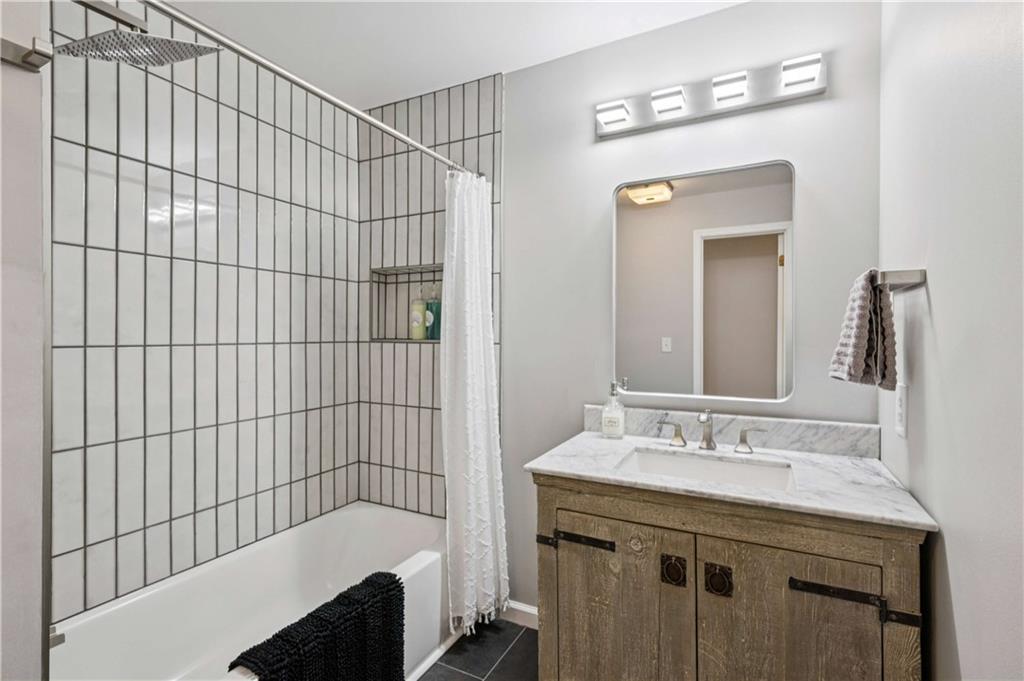 528 Holderness Street Southwest Atlanta, GA 30310 - Photo 34 of 42 a bathroom with a sink and a mirror