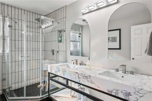 a bathroom with a sink and a mirror
