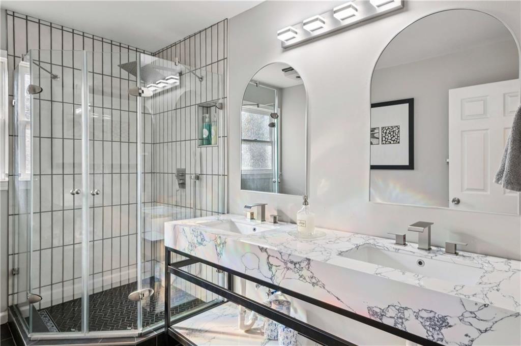 528 Holderness Street Southwest Atlanta, GA 30310 - Photo 36 of 42 a bathroom with a sink and a mirror