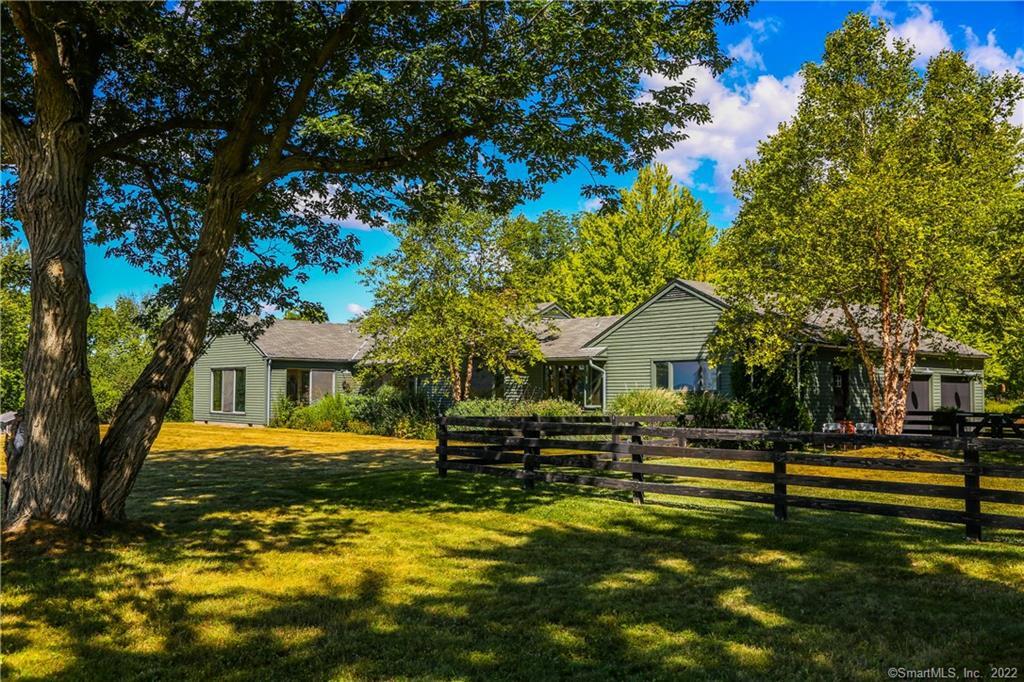 34 Amenia Union Road Sharon, CT 06069 - Photo 1 of 1 a front view of a house with a yard