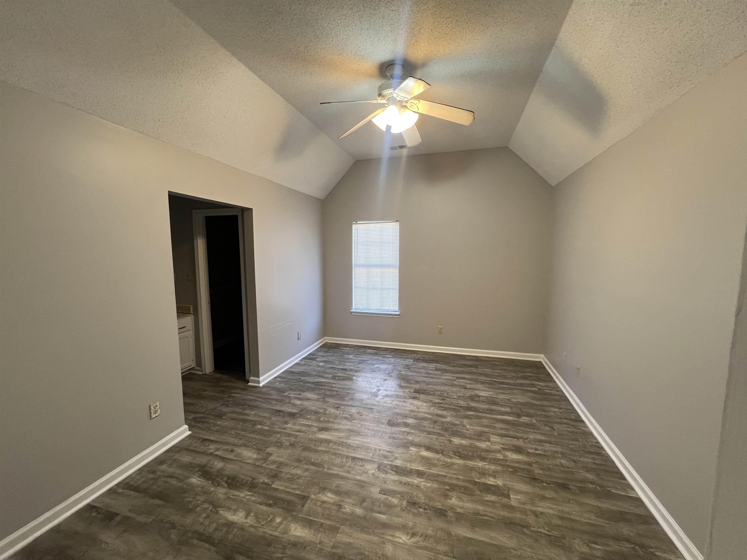 3315 Tulane Road West Horn Lake, MS 38637 - Photo 5 of 13 wooden floor in an empty room with a window
