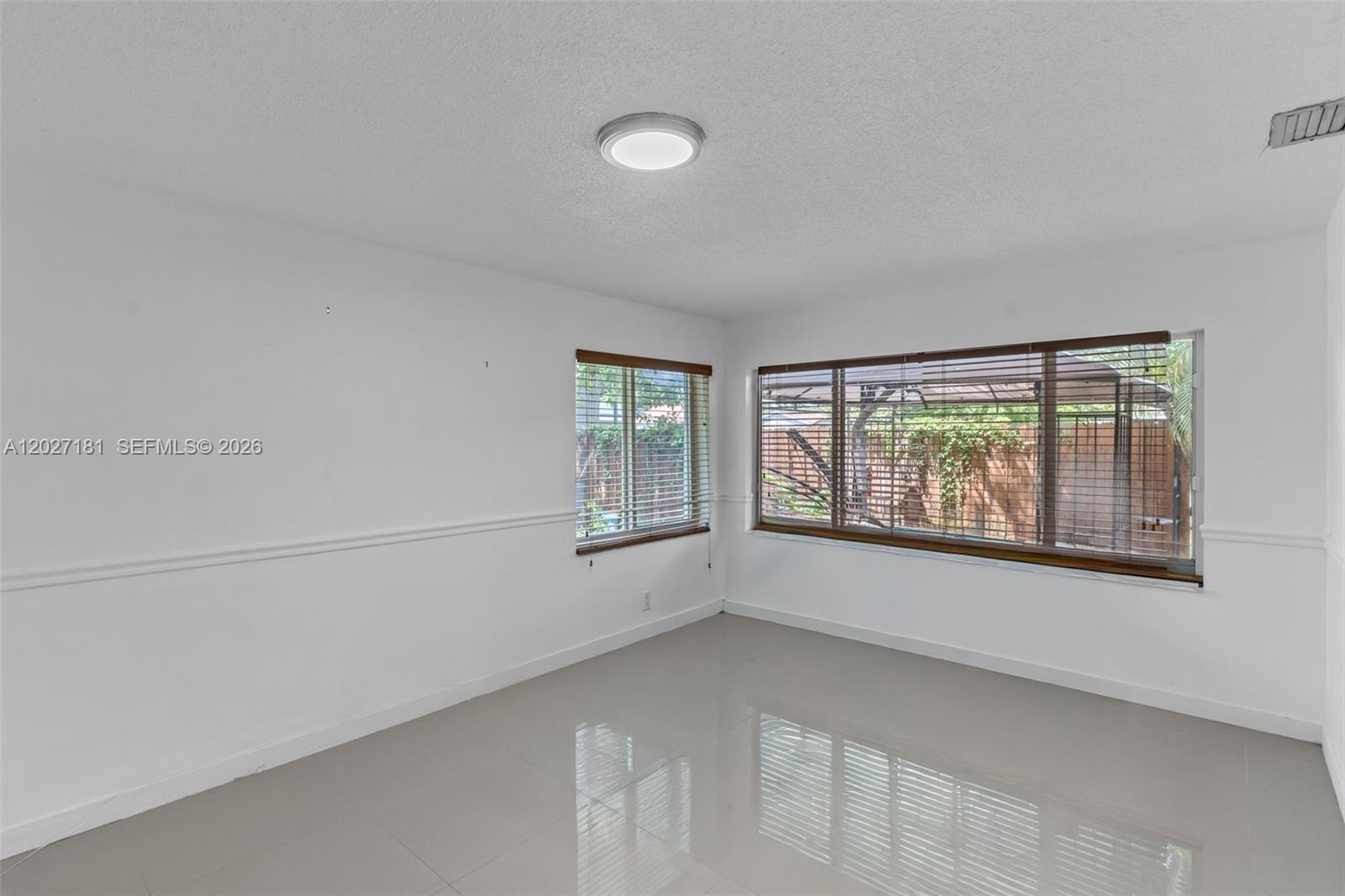 15440 Southwest 294th Terrace Homestead, FL 33033 - Photo 13 of 31 an empty room with windows