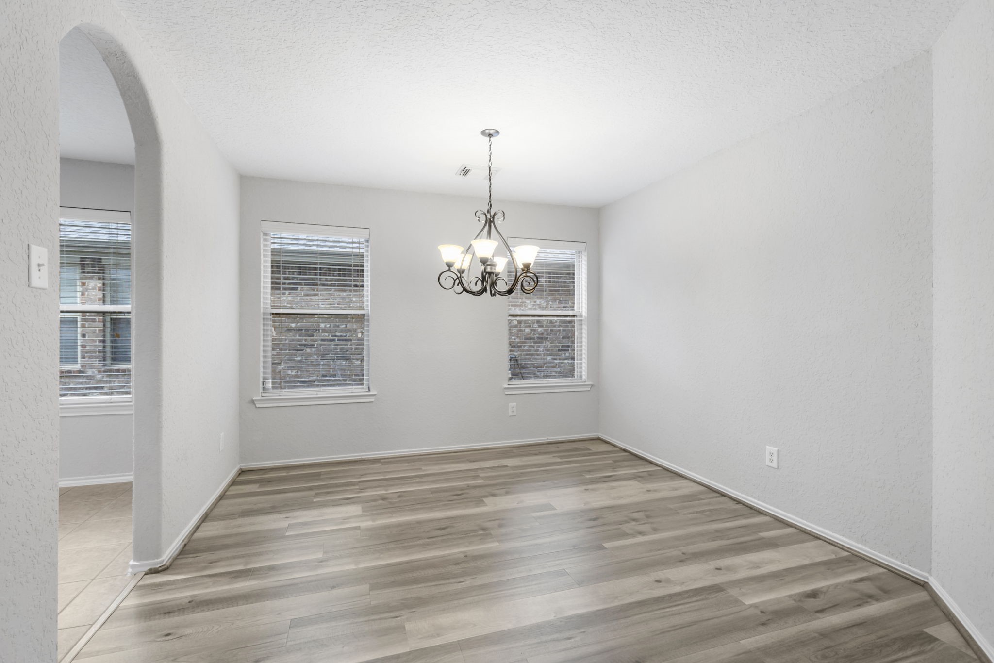 21810 Colter Stone Drive Spring, TX 77388 - Photo 11 of 33 wooden floor in an empty room with a window