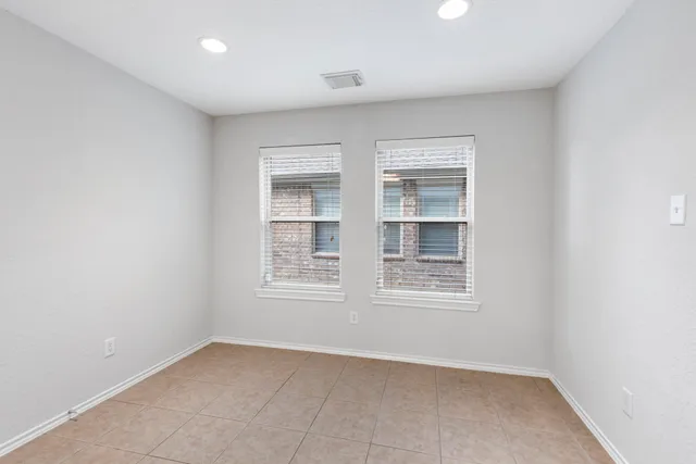 a kitchen with stainless steel appliances granite countertop a sink dishwasher stove and refrigerator with wooden floor