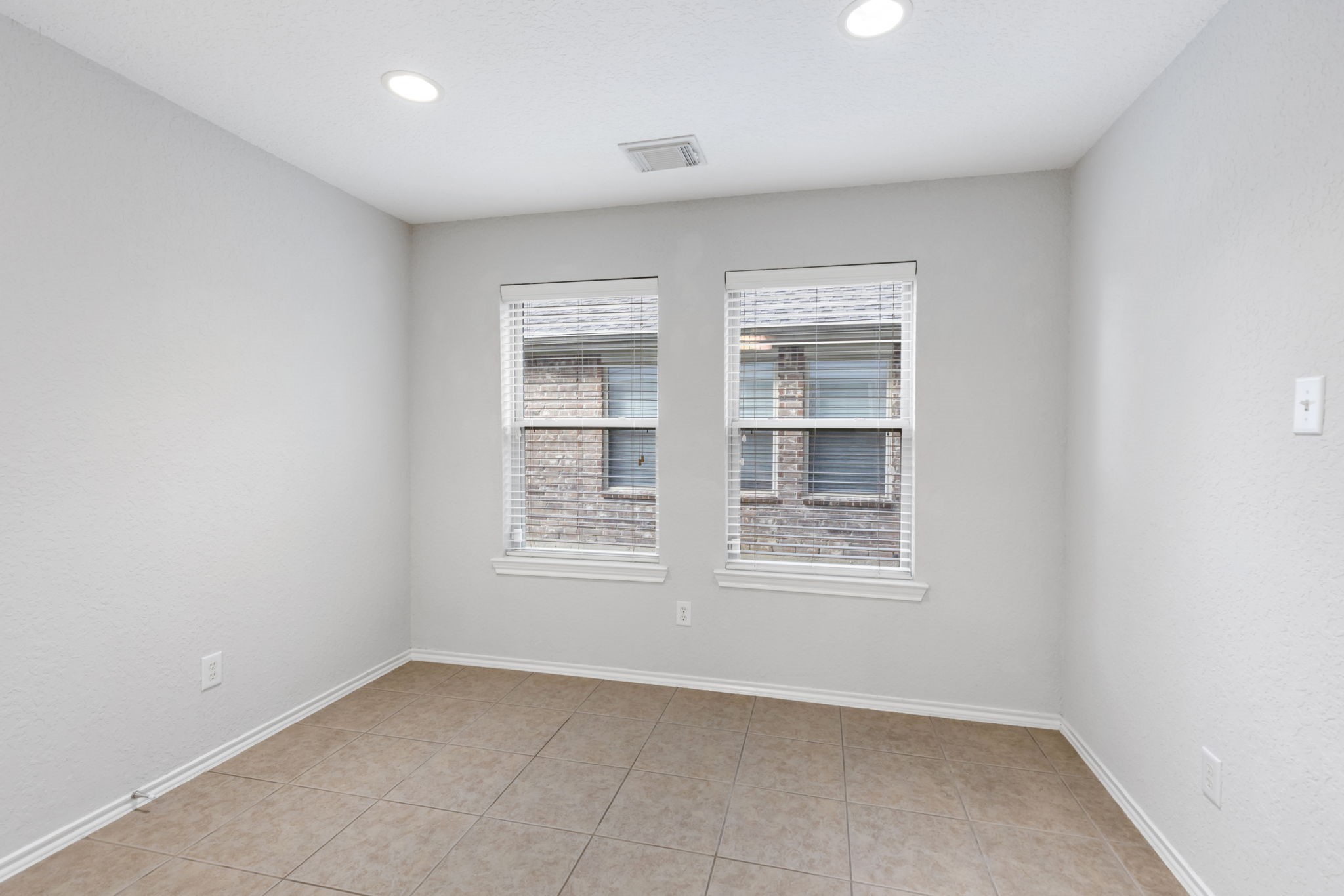 21810 Colter Stone Drive Spring, TX 77388 - Photo 14 of 33 an empty room with windows