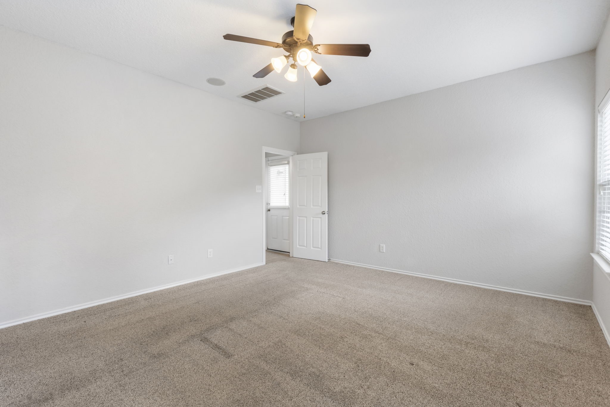 21810 Colter Stone Drive Spring, TX 77388 - Photo 15 of 33 an empty room with chandelier fan