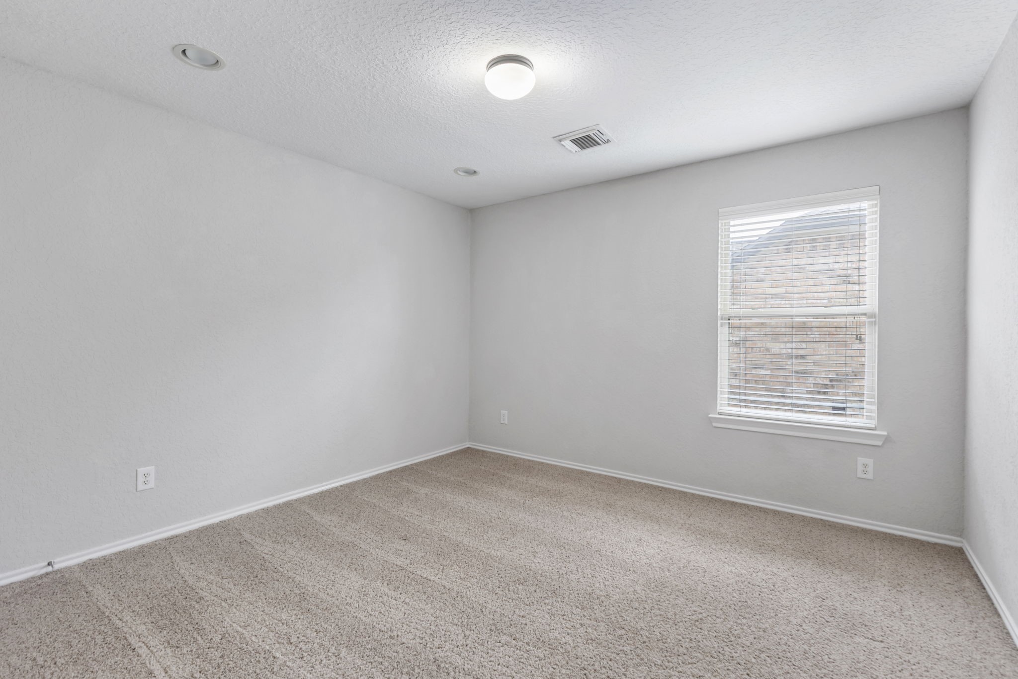 21810 Colter Stone Drive Spring, TX 77388 - Photo 25 of 33 an empty room with a window and a fan