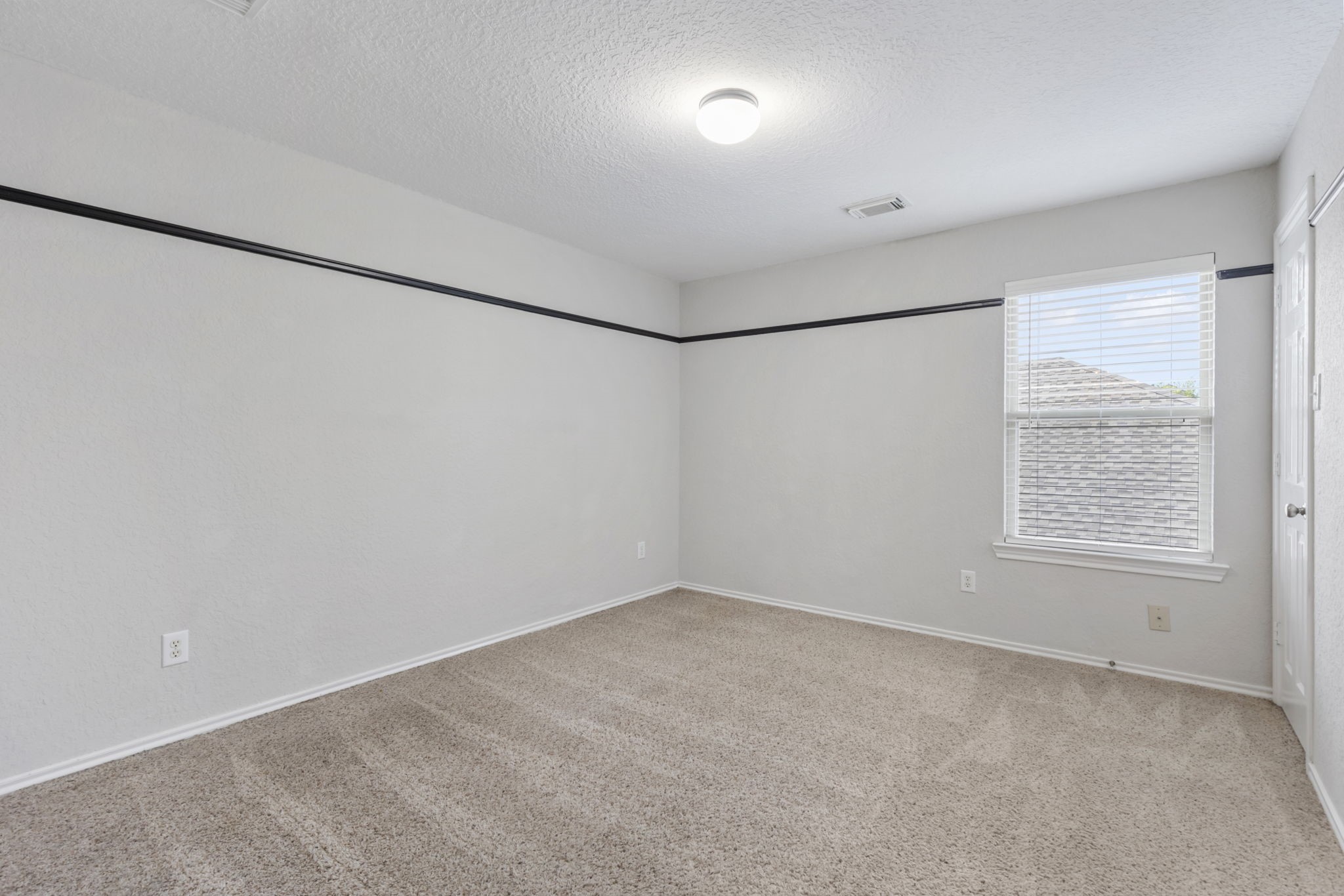 21810 Colter Stone Drive Spring, TX 77388 - Photo 27 of 33 an empty room with a empty space and a window