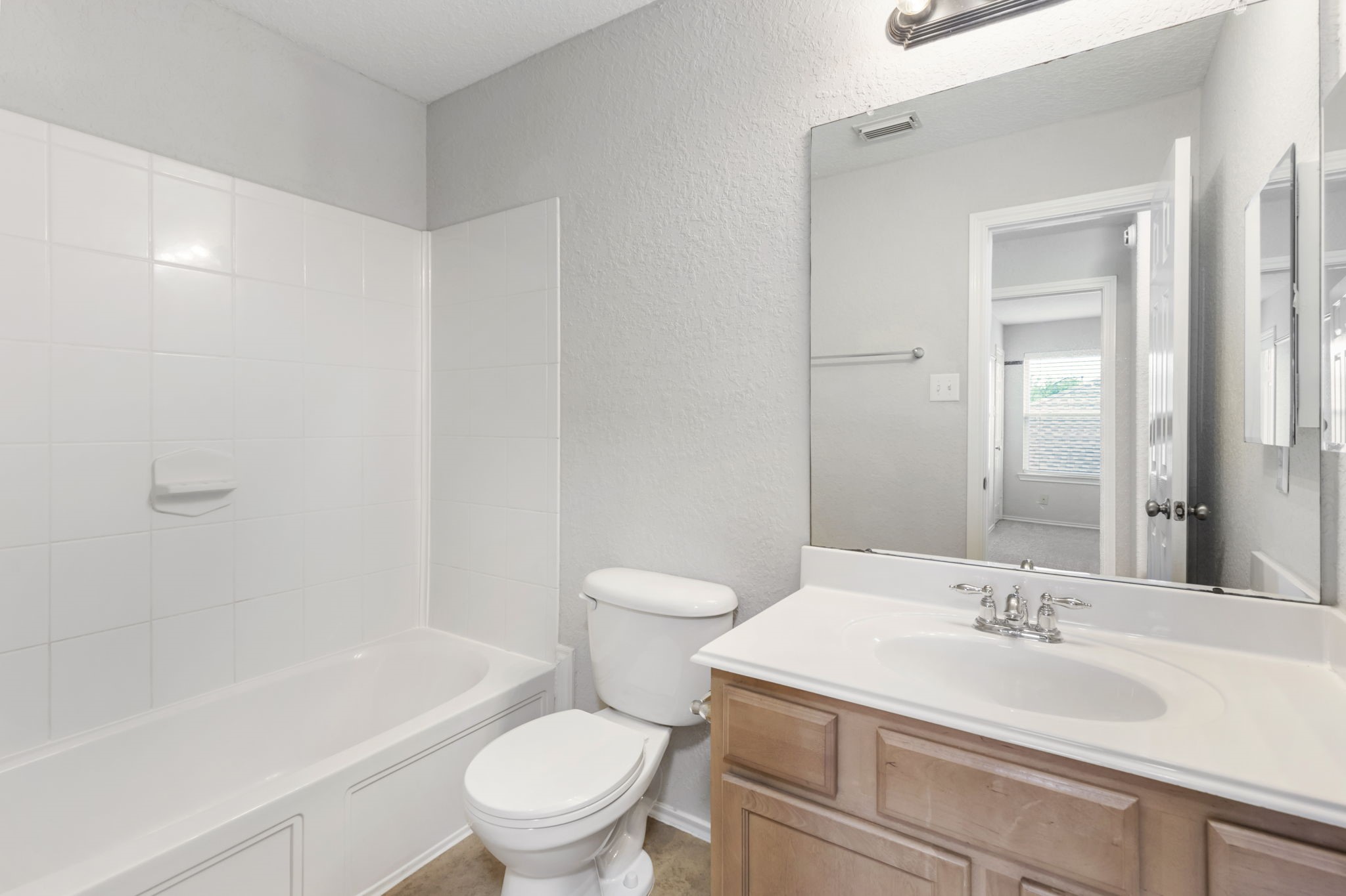 21810 Colter Stone Drive Spring, TX 77388 - Photo 28 of 33 a bathroom with a sink a toilet and a bathtub