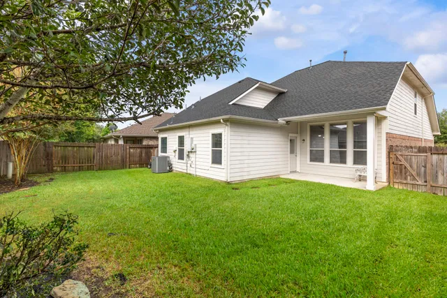 a backyard of a house with lots of green space