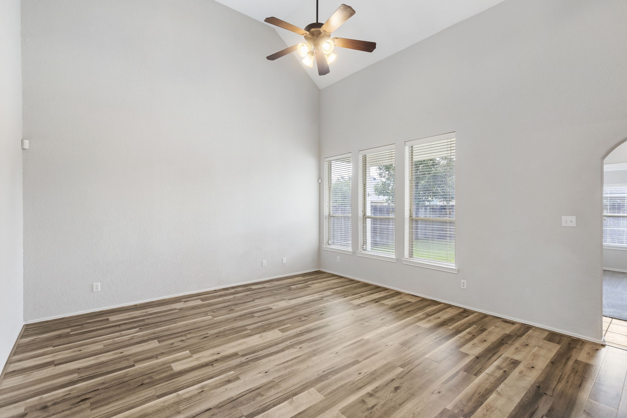 21810 Colter Stone Drive Spring, TX 77388 - Photo 7 of 33 a view of an empty room with window and a kitchen