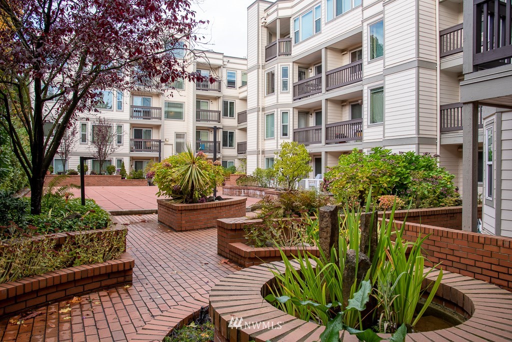2152 North 112th Street, Unit 303 Seattle, WA 98133 - Photo 16 of 19 a view of a building with sitting area