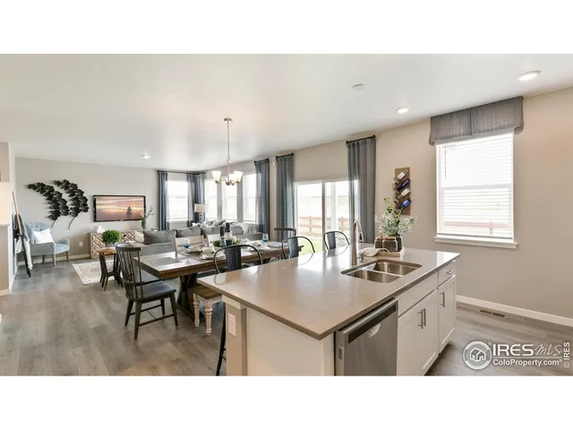 a kitchen with a table and chairs in it
