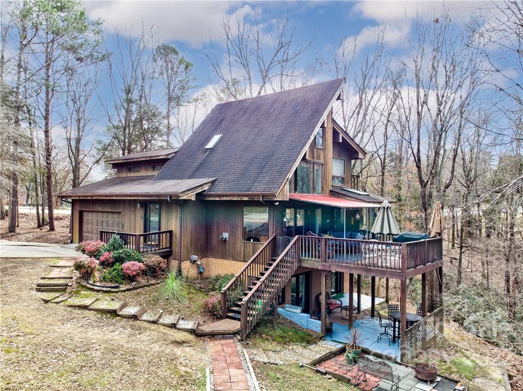 25030 Riley Lane Tega Cay, SC 29708 - Photo 2 of 48 a front view of a house with garden