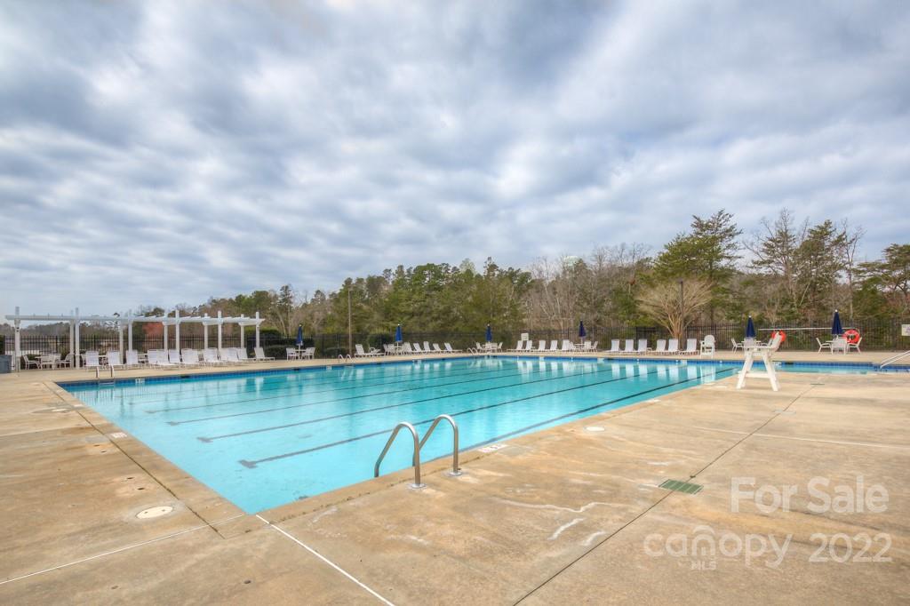 25030 Riley Lane Tega Cay, SC 29708 - Photo 45 of 48 a view of a lake with a yard