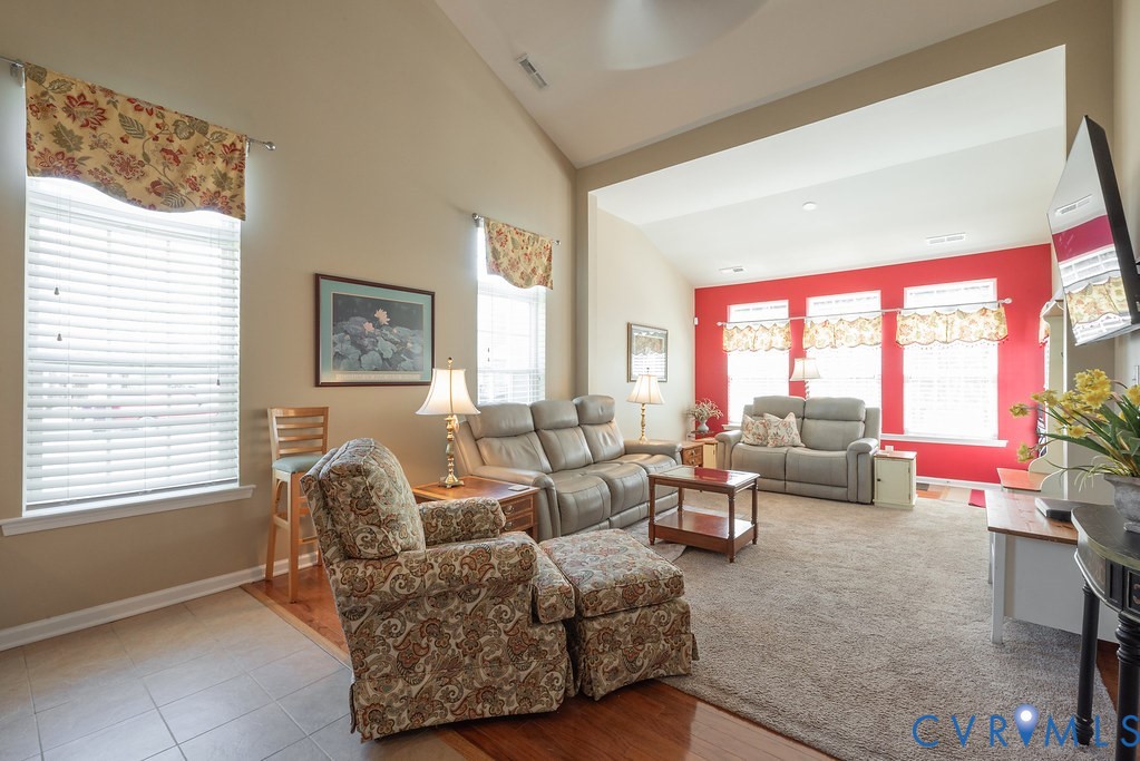10523 Tea Olive Circle Providence Forge, VA 23140 - Photo 19 of 46 a living room with furniture and a floor to ceiling window