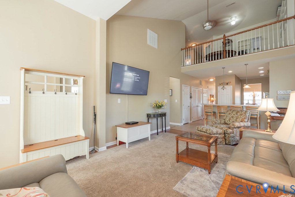 10523 Tea Olive Circle Providence Forge, VA 23140 - Photo 20 of 46 a living room with furniture and a flat screen tv
