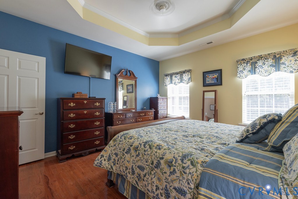 10523 Tea Olive Circle Providence Forge, VA 23140 - Photo 22 of 46 a bedroom with a bed and a flat screen tv