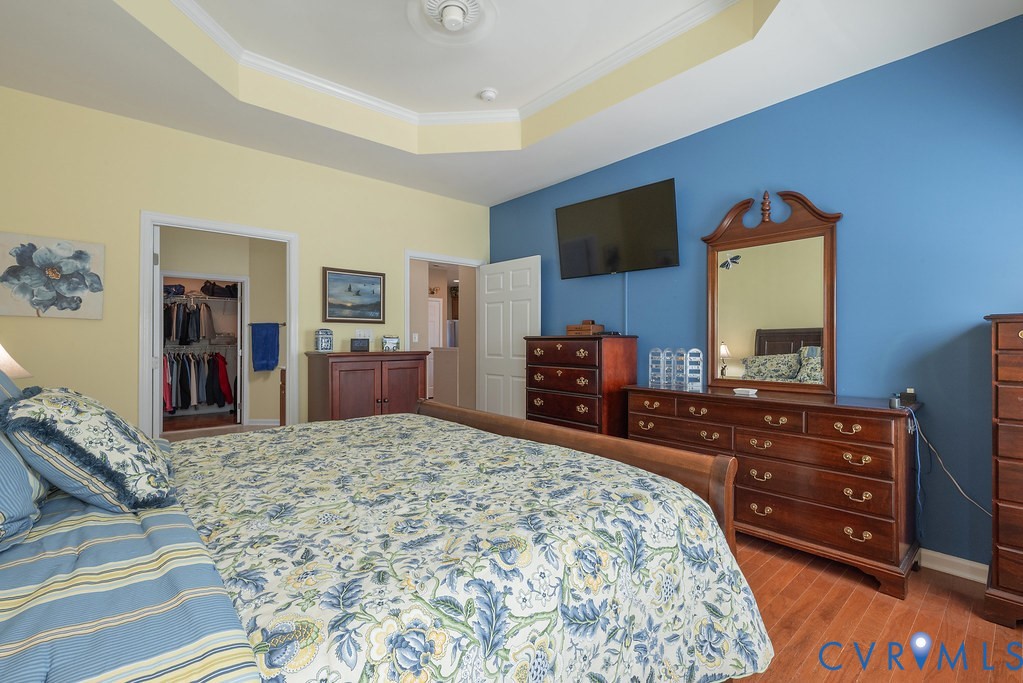 10523 Tea Olive Circle Providence Forge, VA 23140 - Photo 23 of 46 a bedroom with a bed and a flat screen television