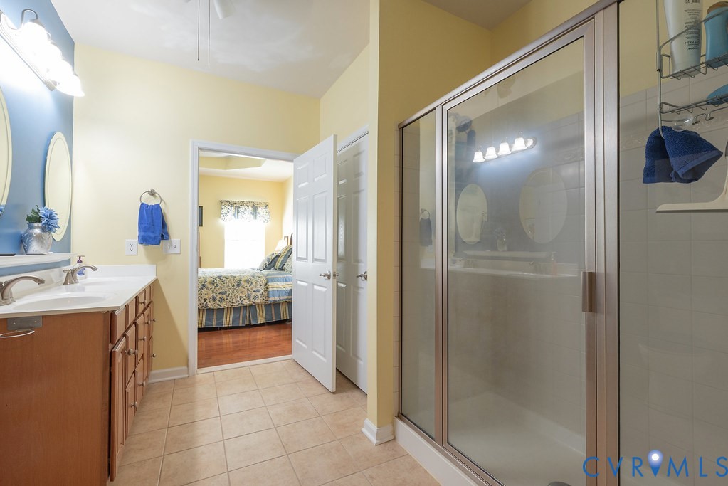 10523 Tea Olive Circle Providence Forge, VA 23140 - Photo 26 of 46 a bathroom with a sink mirror and shower