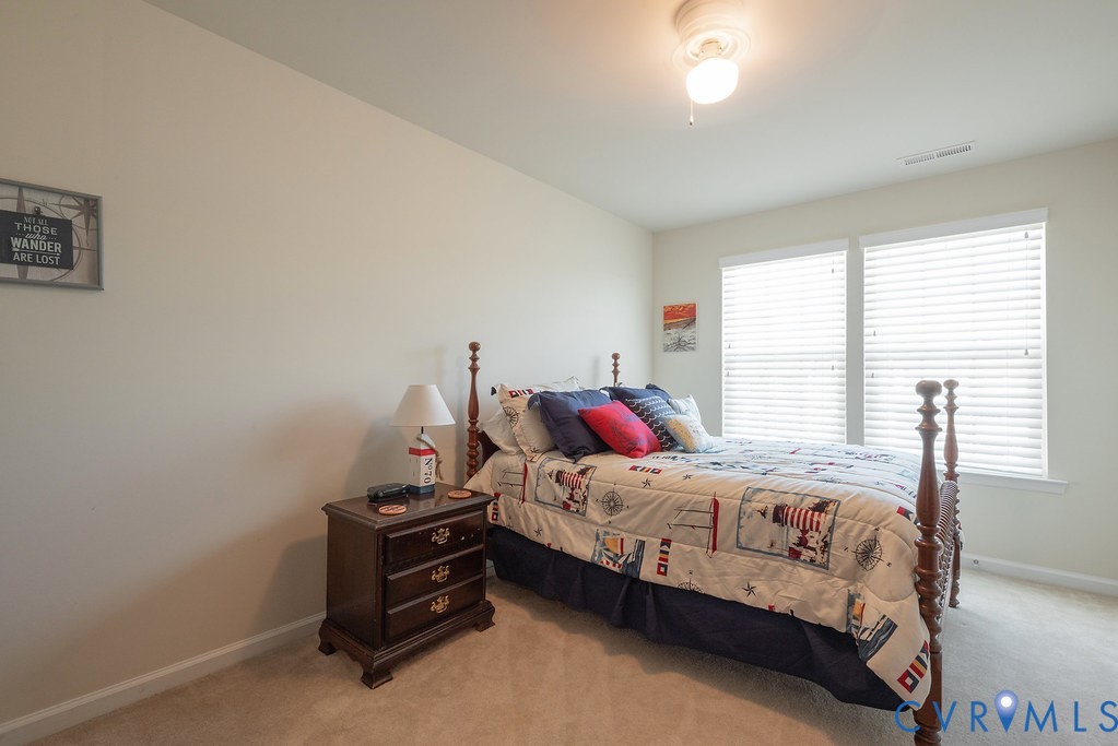 10523 Tea Olive Circle Providence Forge, VA 23140 - Photo 30 of 46 a bedroom with a bed and a window