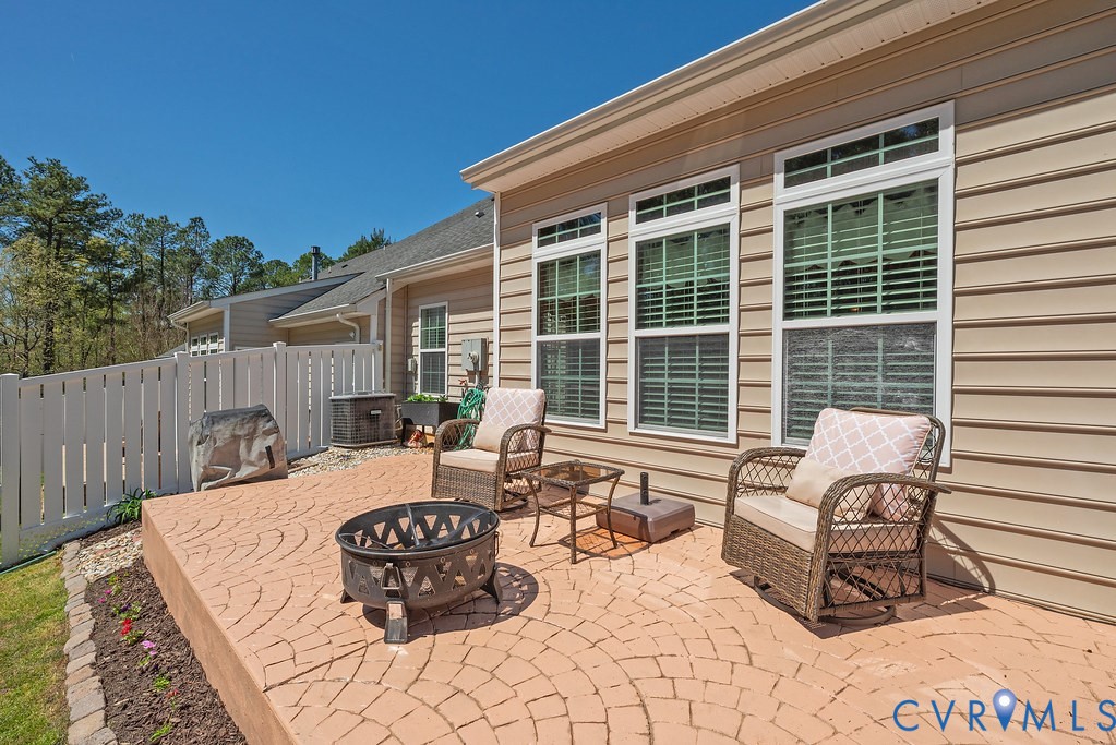 10523 Tea Olive Circle Providence Forge, VA 23140 - Photo 39 of 46 a view of a patio with a dining table and chairs