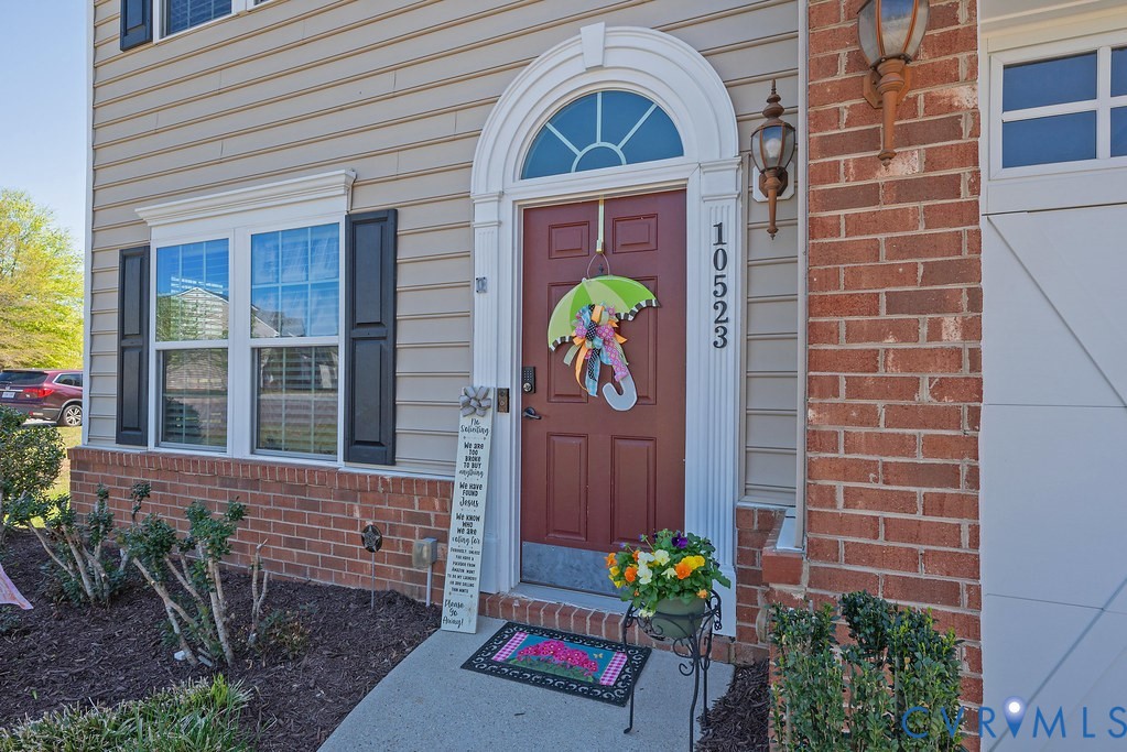 10523 Tea Olive Circle Providence Forge, VA 23140 - Photo 7 of 46 a front view of a house with a yard